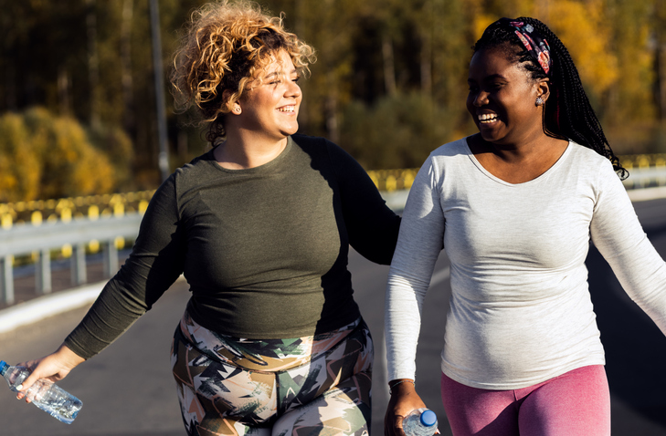 Two women walking outside